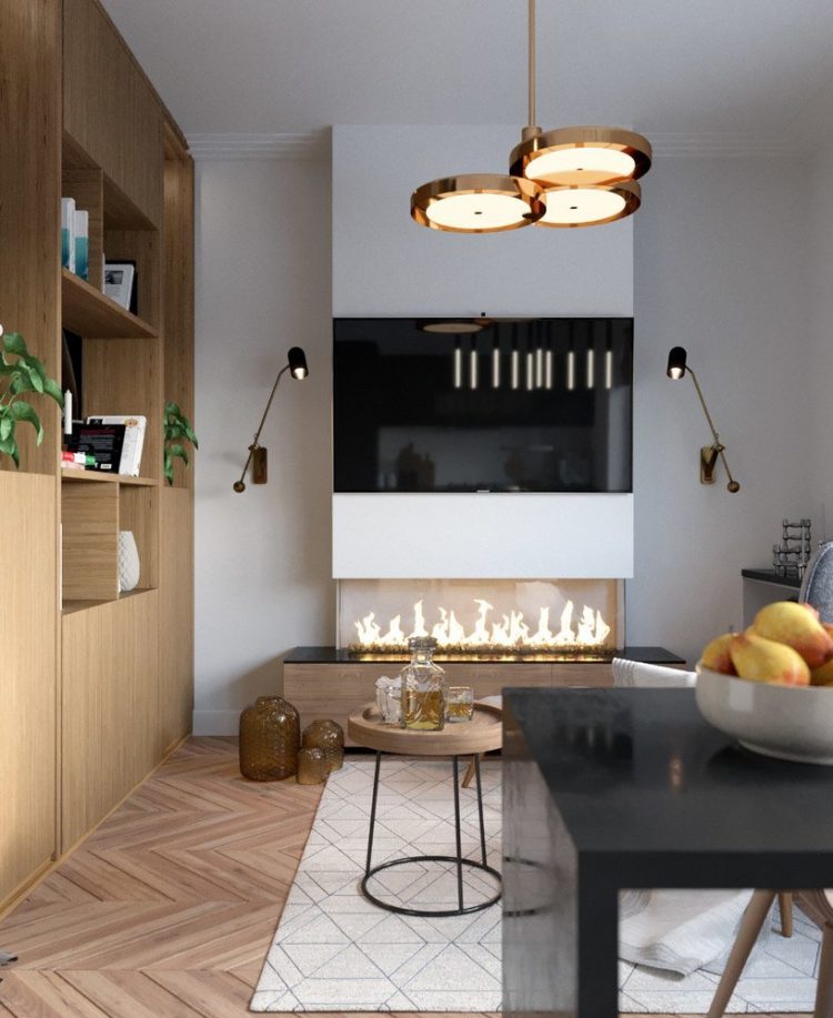 Chiếc tivi lớn nơi phòng khách được gắn cố định vào tường nhằm tiết kiệm diện tích cho căn hộ.