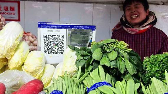 
Quầy bán rau ở chợ Trung Quốc. Ảnh: CGTN
