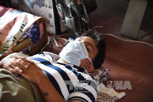 Bệnh nhân nhiễm virus cúm H1N1 điều trị tại bệnh viện ở Ahmedabad, Ấn Độ. Ảnh: AFP/TTXVN