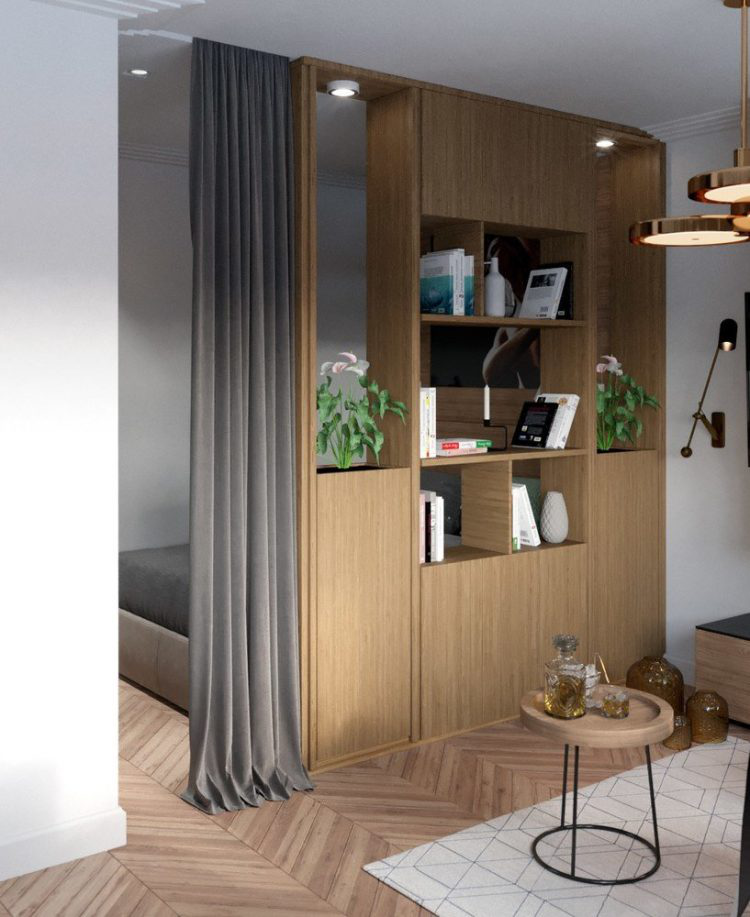Chỉ với 27m2 nhưng gia chủ của căn hộ này đã khá khéo léo trong việc tách biệt các không gian bằng vách ngăn với hệ kệ gỗ đơn giản, gọn nhẹ.