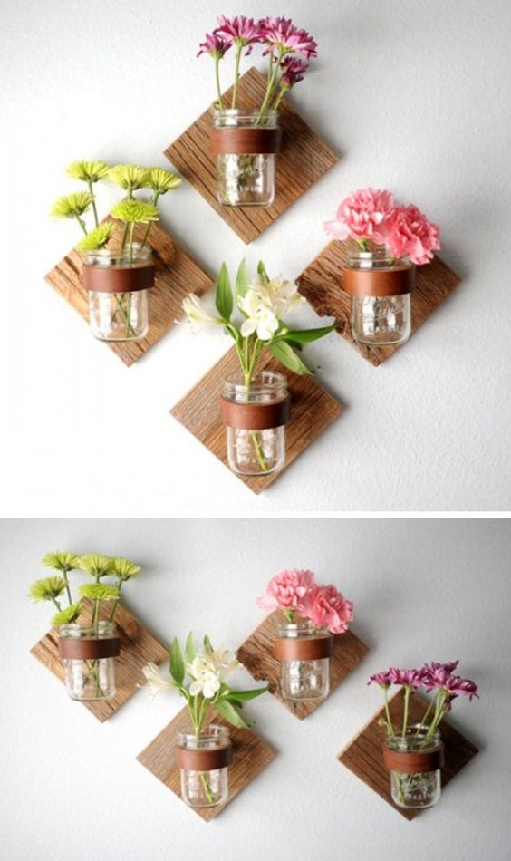
Những bình thủy tinh hoa trong suốt được gắn cố định vào tấm gỗ nhỏ trên bức tường là một sáng kiến tuyệt vời giúp cho bức tường đơn điệu trở nên đẹp hơn. (Ảnh Pinterest)

 
