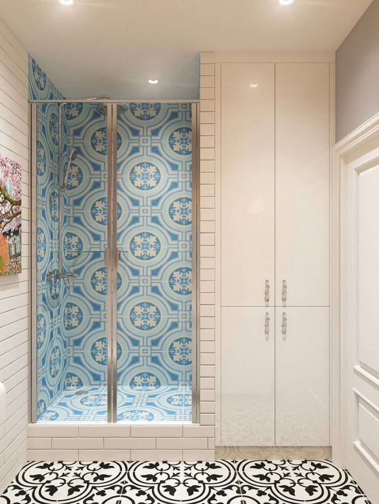  Khu nhà tắm được dành một vị trí riêng biệt với màu gạch ốp tường xanh mát mắt và cửa kính trong suốt. 