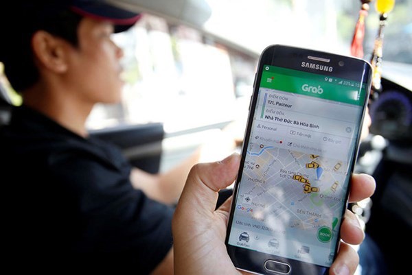 Từ bây giờ hãy xem Uber, Grab như taxi điện tử - Ảnh 1.