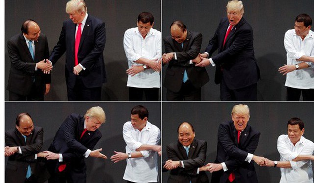
Hình ảnh ông Donald Trump bối rối khi bắt tay kiểu truyền thống ASEAN. Ảnh: Reuters
