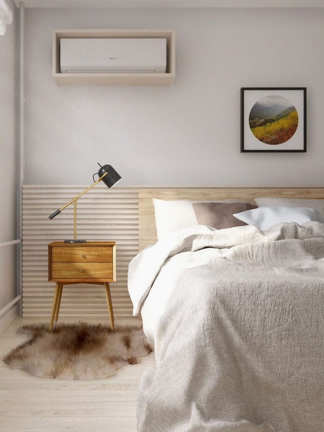 Để tăng thêm ánh sáng cho căn phòng hẹp, chiếc bóng đèn nhỏ được kết nối ngay phía đầu giường, giúp chan hòa ánh sáng và cân bằng màu sắc cho không gian. 