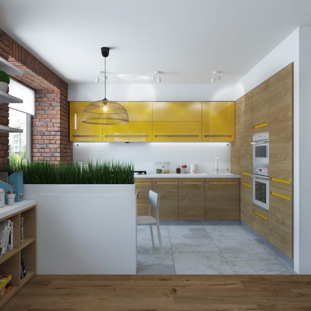 
Nối liền phòng khách là bếp ăn nhỏ. Góc nhỏ này được thiết kế nổi bật với tủ bếp màu vàng chanh trên nền bức tường trắng.

 
