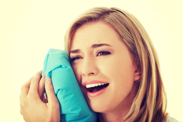 11 cách giúp bạn dịu cơn đau do mọc răng khôn - Ảnh 2.