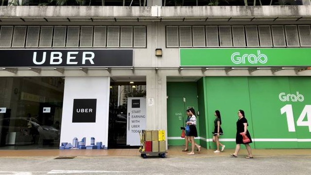 Singapore điều tra vụ Grab mua lại Uber Đông Nam Á - Ảnh 1.