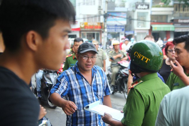 Xử phạt chủ ô tô xưng xe của Bộ Công an, đậu trái phép trước Bệnh viện Từ Dũ - Ảnh 4.