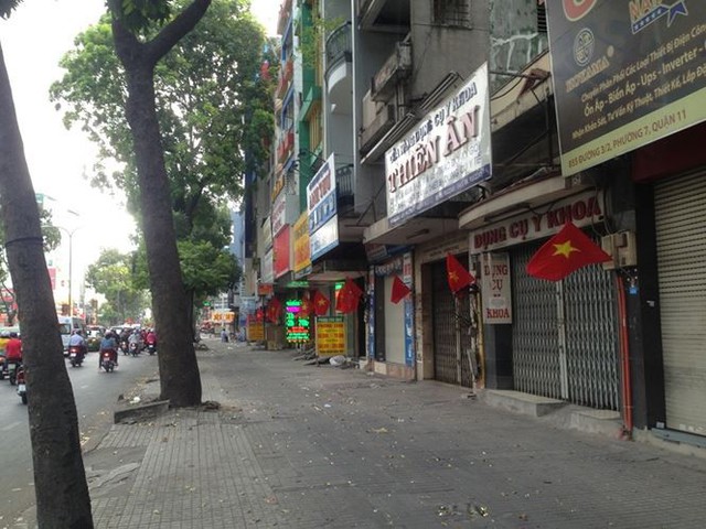 Đường phố Sài Gòn dịu dàng sáng mùng 1 Tết - Ảnh 14.