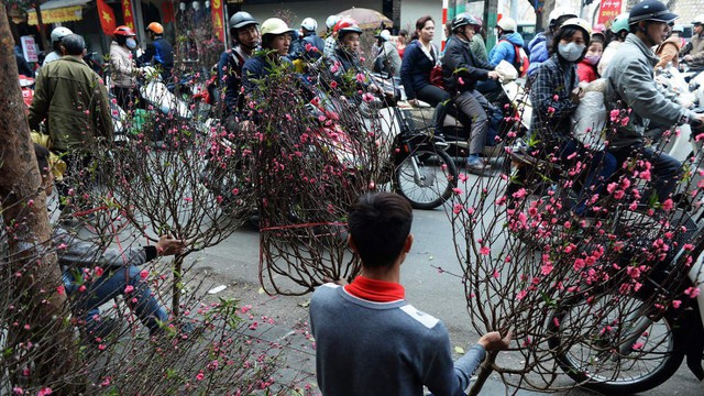 CNN bầu chọn 12 hình ảnh Tết Nguyên Đán trên khắp thế giới, Việt Nam góp mặt với khung cảnh giản dị thân quen - Ảnh 5. CNN bầu chọn 12 hình ảnh Tết Nguyên Đán trên khắp thế giới, Việt Nam góp mặt với khung cảnh giản dị thân quen - Ảnh 5.