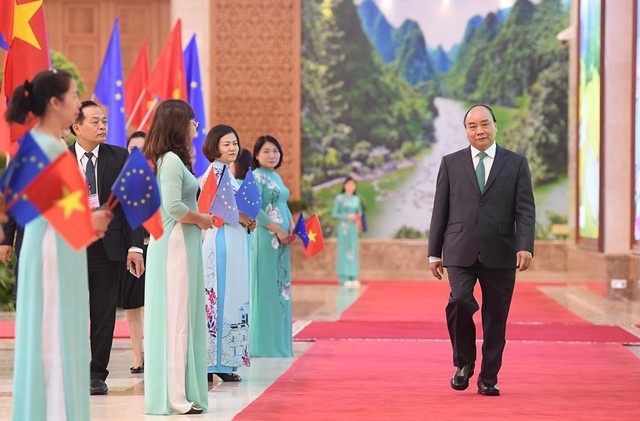 Những khoảnh khắc ấn tượng trong lễ ký kết lịch sử giữa Việt Nam và EU - Ảnh 1.