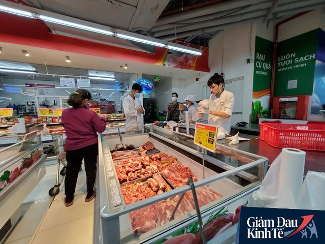  Giá thịt lợn cuối tuần tại siêu thị giảm mạnh tới 25% dù lợn hơi vẫn ở mức 80.000 đồng/kg - Ảnh 1.