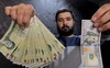 Iran: Bất ổn xã hội, tiền mất giá, cử nhân kinh tế làm 