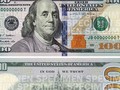 Mang 1.000 tờ USD giả mệnh giá đến ngân hàng đổi
