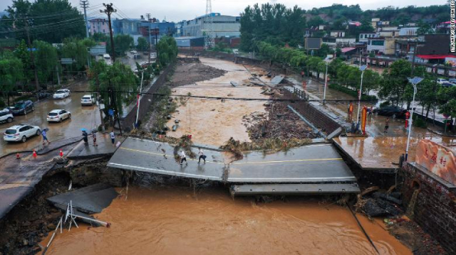 Mưa lũ tồi tệ tại Trung Quốc đe dọa nguồn cung nhôm, rau, ngô - Ảnh 1.