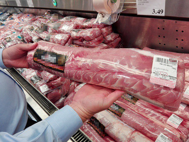 Giá lợn hơi giảm sâu, người tiêu dùng vẫn mua thịt lợn giá cao - Ảnh 2.