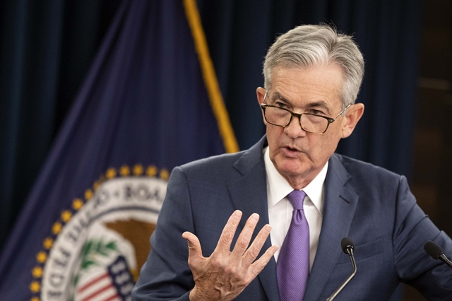 Fed giữ nguyên lãi suất, ám chỉ bắt đầu tăng từ tháng 3 - Ảnh 1.