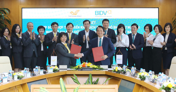 BIDV và Vietnam Post hợp tác triển khai dịch vụ thu hộ bảo hiểm - Ảnh 1.