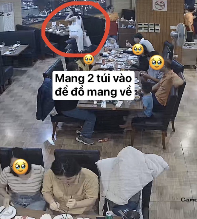 Ăn buffet hải sản Hà Nội, đôi nam nữ lén lút đút túi 4kg mang về, bị camera tố cáo - Ảnh 1.
