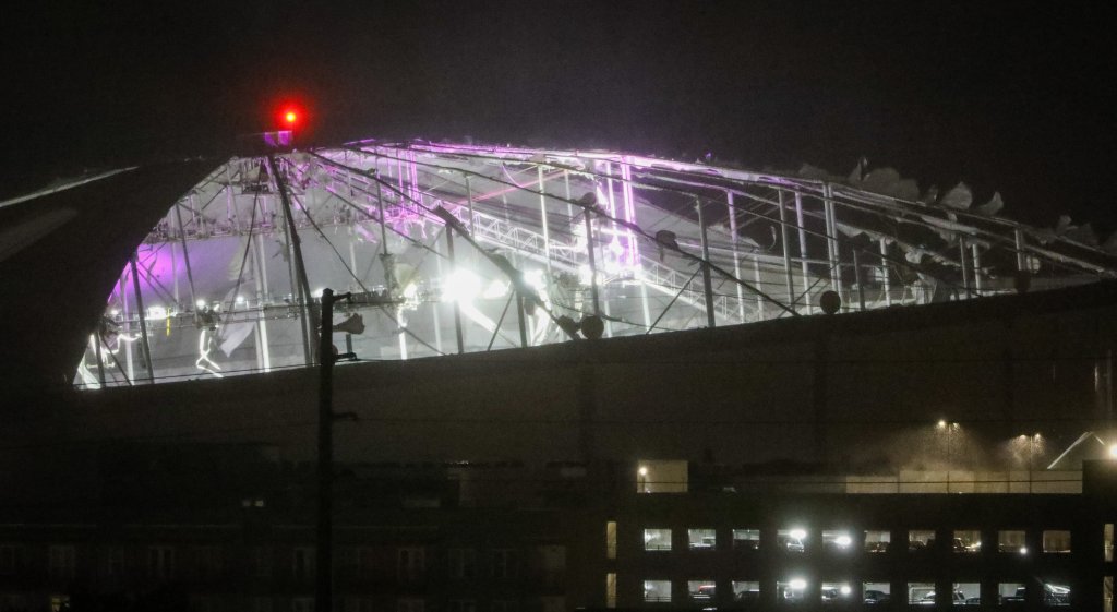 The stadium's lighting system and roof supports beams were visible from the outside.