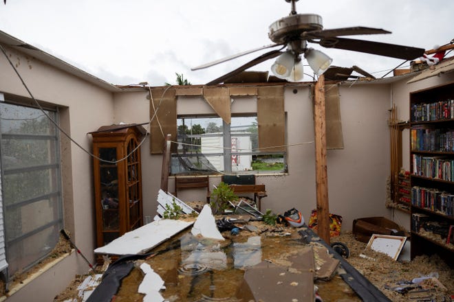 View of the living room of a house destroyed by a passing tornado as Hurricane Milton approaches Fort Myers, Florida.