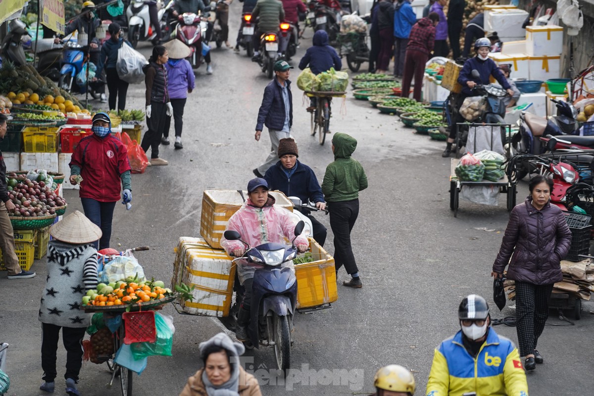 Nhịp sống người dân Thủ đô trong những ngày lạnh 14 độ- Ảnh 6.