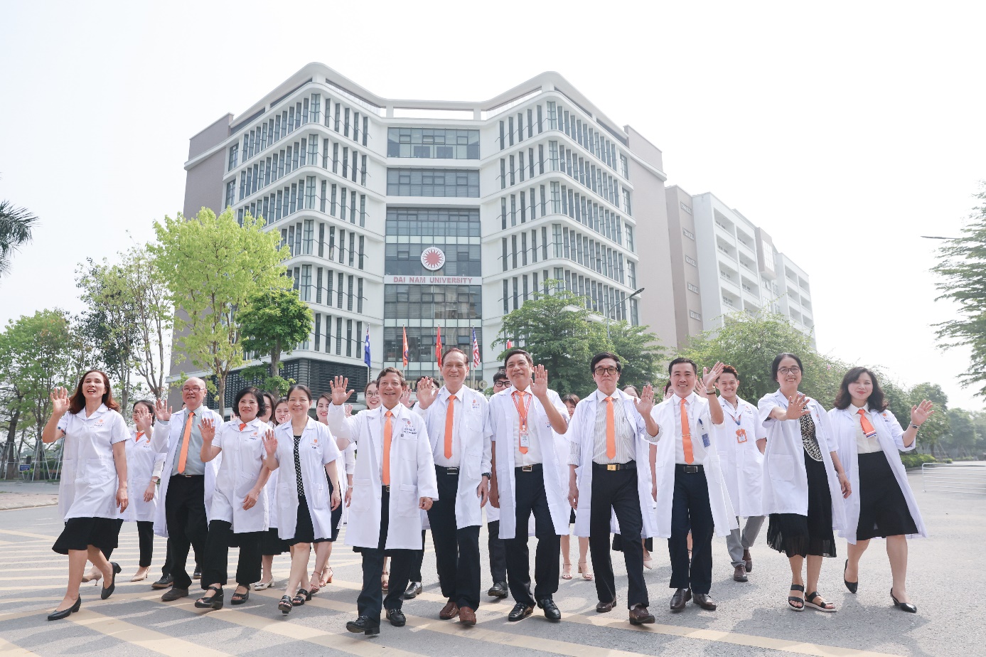 A group of people in white coats  Description automatically generated