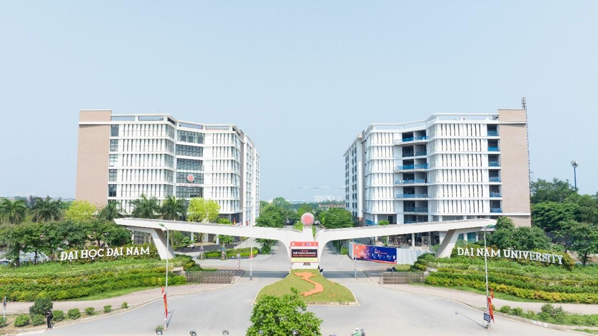 A white building with a cross over a road  Description automatically generated with medium confidence