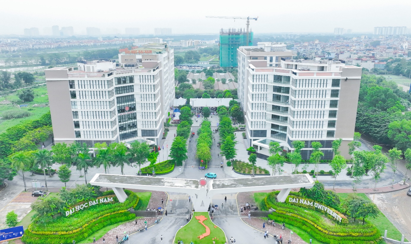 A group of buildings with trees and a road  Description automatically generated with medium confidence