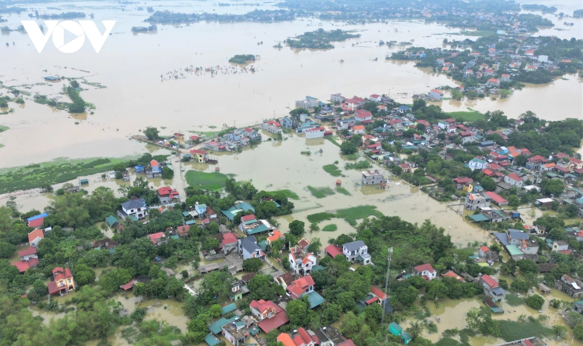 Nước sông Hoàng Long bắt đầu rút, nhiều nơi ở Ninh Bình vẫn chìm trong nước- Ảnh 1.