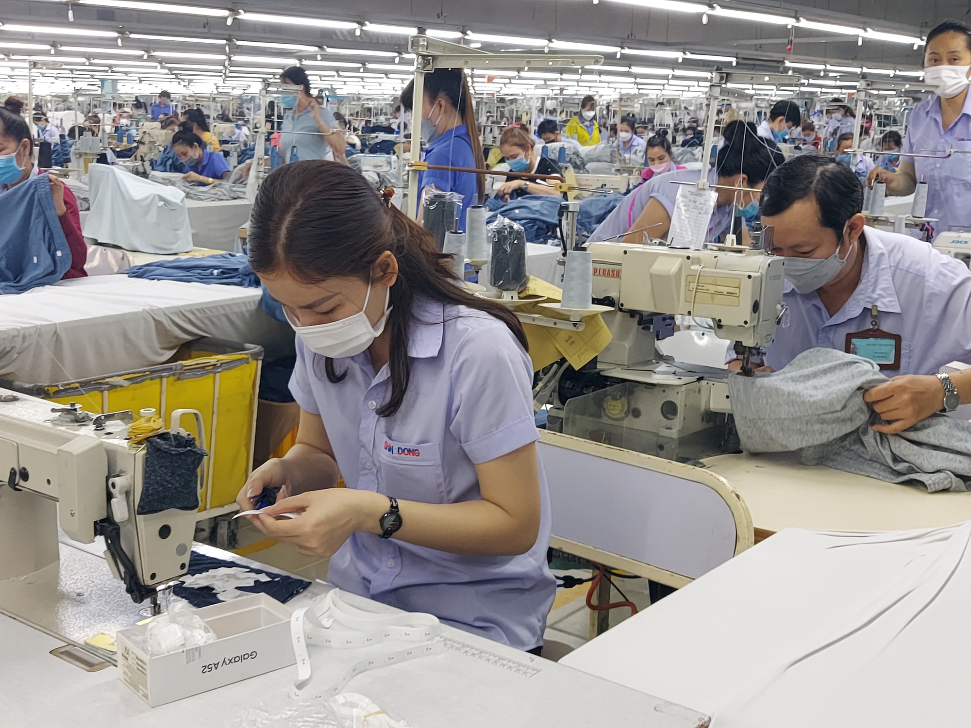 Chi nhánh doanh nghiệp ở nhiều vùng, áp dụng mức lương tối thiểu thế nào?- Ảnh 1.