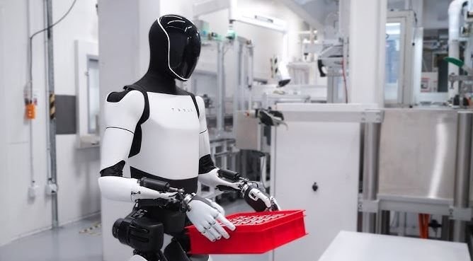 Bên trong phòng thí nghiệm robot của Tesla: Nhân viên phải mặc đồ chuyên biệt, đeo gần 20kg thiết bị trên lưng để ghi hình- Ảnh 1.