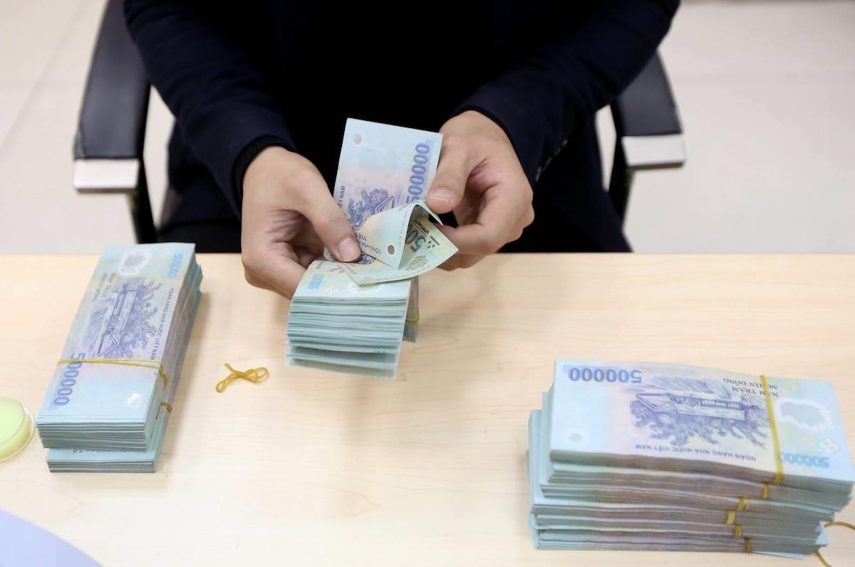 Doanh nghiệp gửi hơn 8,35 triệu tỷ vào ngân hàng- Ảnh 1.