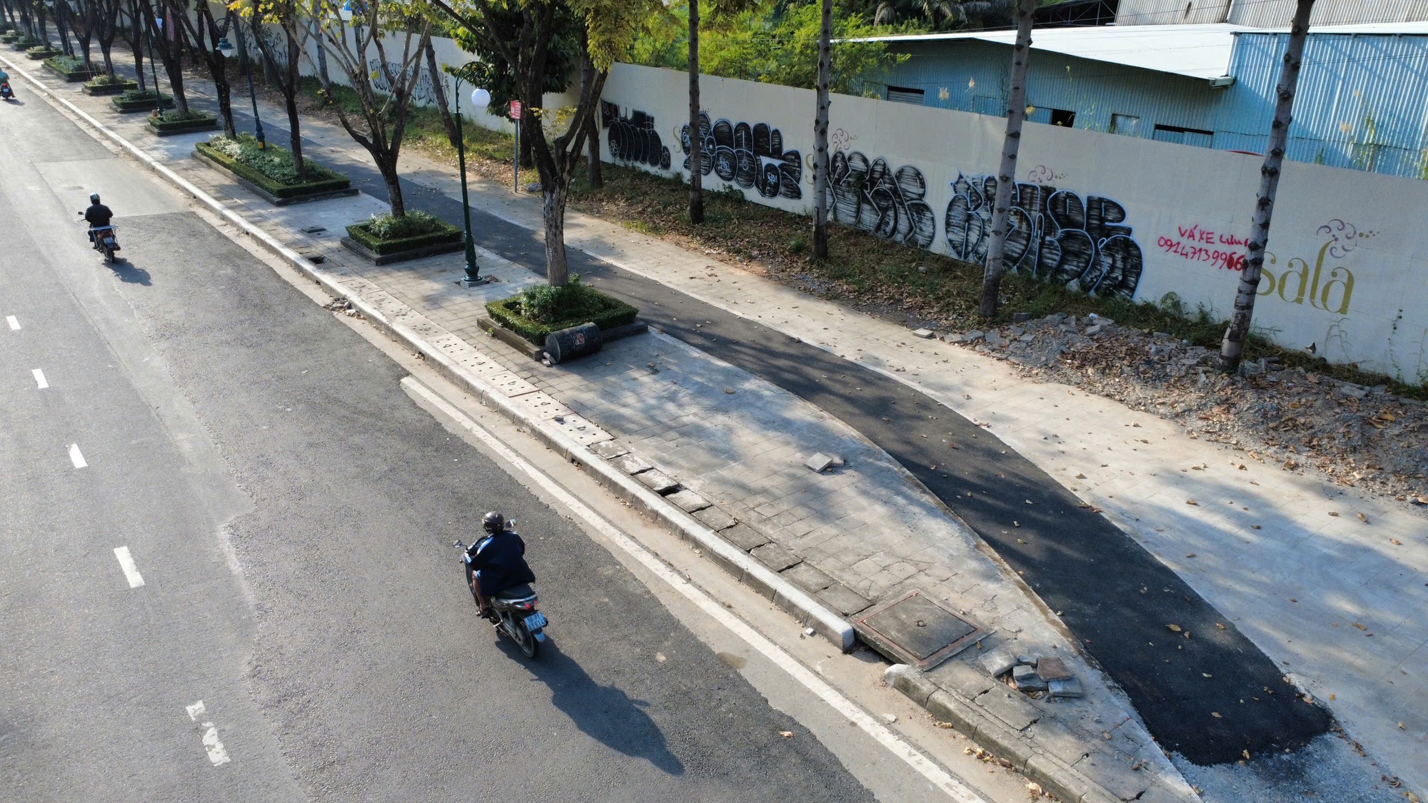 Làn xe đạp trên đường Mai Chí Thọ hoàn thành, xe máy cần tránh nếu không muốn bị phạt - Ảnh 9.