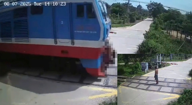 Camera ghi lại khoảnh khắc người đàn ông “đứng im khi tàu hỏa lao tới”- Ảnh 1. Camera ghi lại khoảnh khắc người đàn ông “đứng im khi tàu hỏa lao tới”- Ảnh 1.
