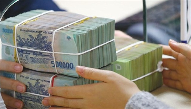 Những trường hợp nghỉ việc do sắp xếp bộ máy được hưởng 24 tháng tiền lương, nhận lương hưu ngay- Ảnh 1.