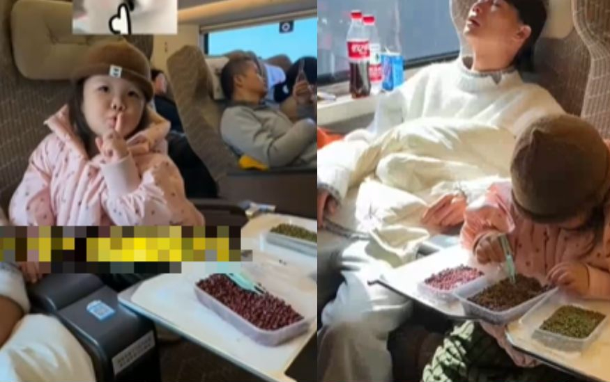 Hình ảnh ông bố và con gái trên chuyến tàu đông đúc gây sốt: Nhìn đồ vật phía dưới bàn, phải khen dạy con sao mà khéo thế!- Ảnh 1.