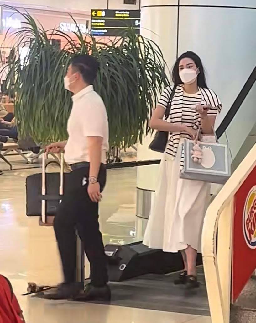 Vóc dáng Hoa hậu Đỗ Hà qua ảnh "team qua đường" giữa lúc vướng tin bầu bí - Ảnh 1.