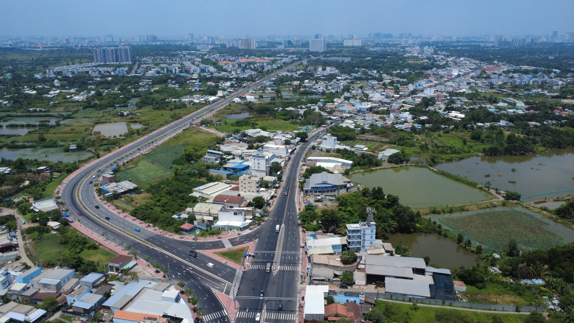 Thông xe tạm cầu Ông Thìn thúc đẩy mở rộng Quốc lộ 50 năm 2026 - Ảnh 1.