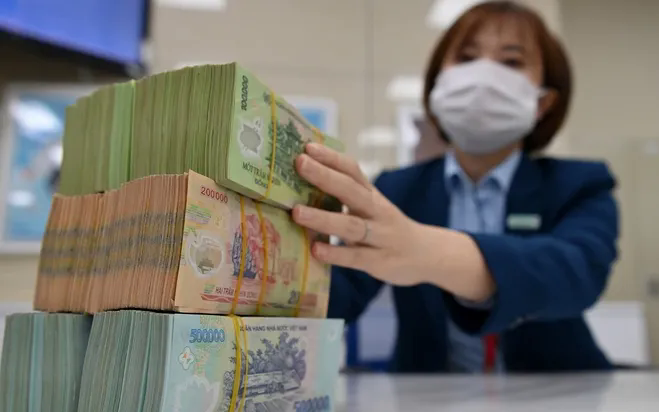 Một số ngân hàng hạ lãi suất cho vay - Ảnh 1.