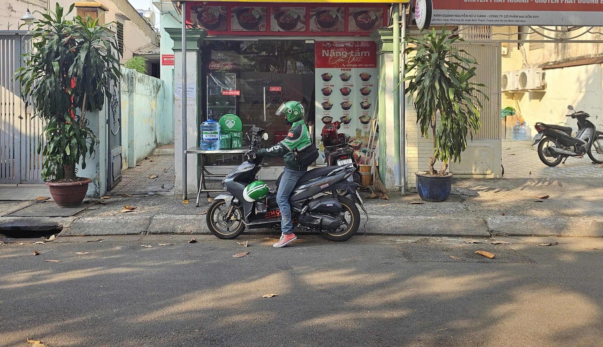 Đằng sau những cuốc xe của tài xế Grab lâu năm- Ảnh 1.