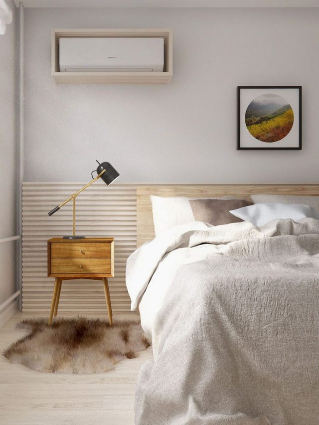 Để tăng thêm ánh sáng cho căn phòng hẹp, chiếc bóng đèn nhỏ được kết nối ngay phía đầu giường, giúp chan hòa ánh sáng và cân bằng màu sắc cho không gian. 