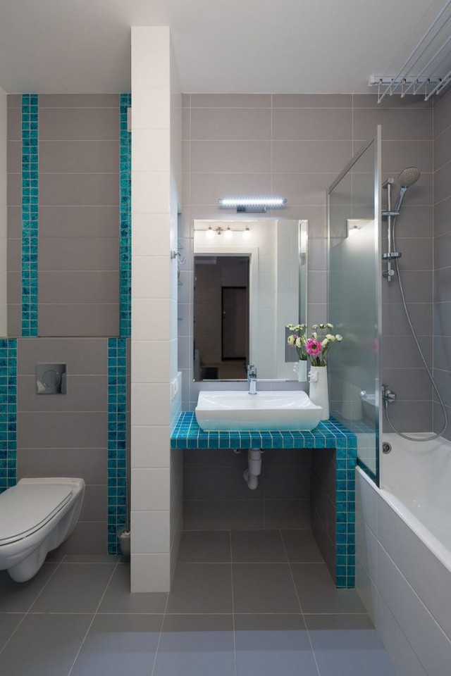 Vẫn có màu xanh ngọc lam điểm xuyến, không gian phòng tắm phát triển thành đẹp và tươi mát. 