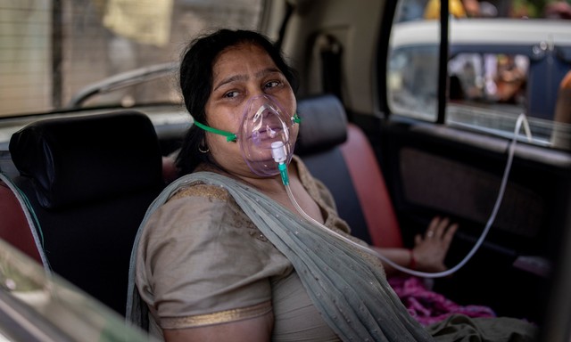 Sau bãi hỏa táng là loạt ảnh bệnh nhân Covid-19 ở Ấn Độ vật vã thở oxy chờ được nhập viện - Ảnh 5.