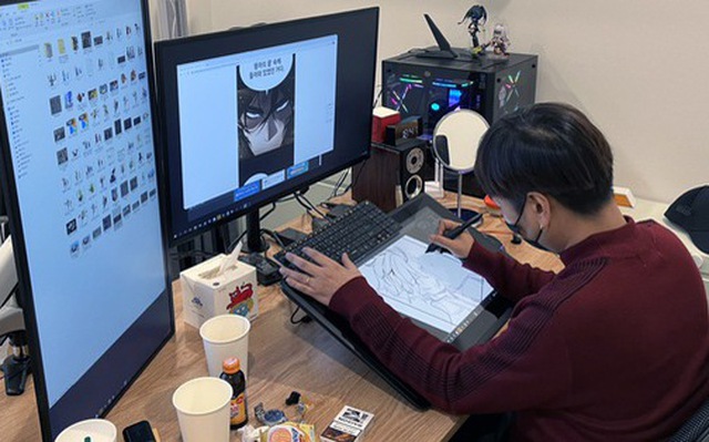 Một họa sĩ truyện tranh kỹ thuật số (webtoon) đang sáng tác tại văn phòng công ty webtoon Kenaz ở thủ đô Seoul, Hàn Quốc - Ảnh: BLOOMBERG