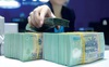 Thừa tiền, các ngân hàng cho nhau vay mượn gần như không lấy lãi