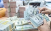 Sẵn sàng giải quyết áp lực giảm giá VND