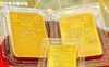 Tỷ giá USD tăng khiến giá vàng trong nước đứng im