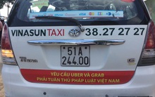 Bộ Công Thương đang xem xét việc dán khẩu hiệu phản đối Uber, Grab